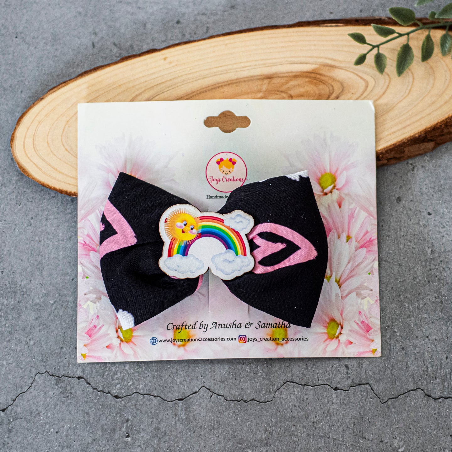 WHIMSICAL BOW CLIP BLACK RAINBOW